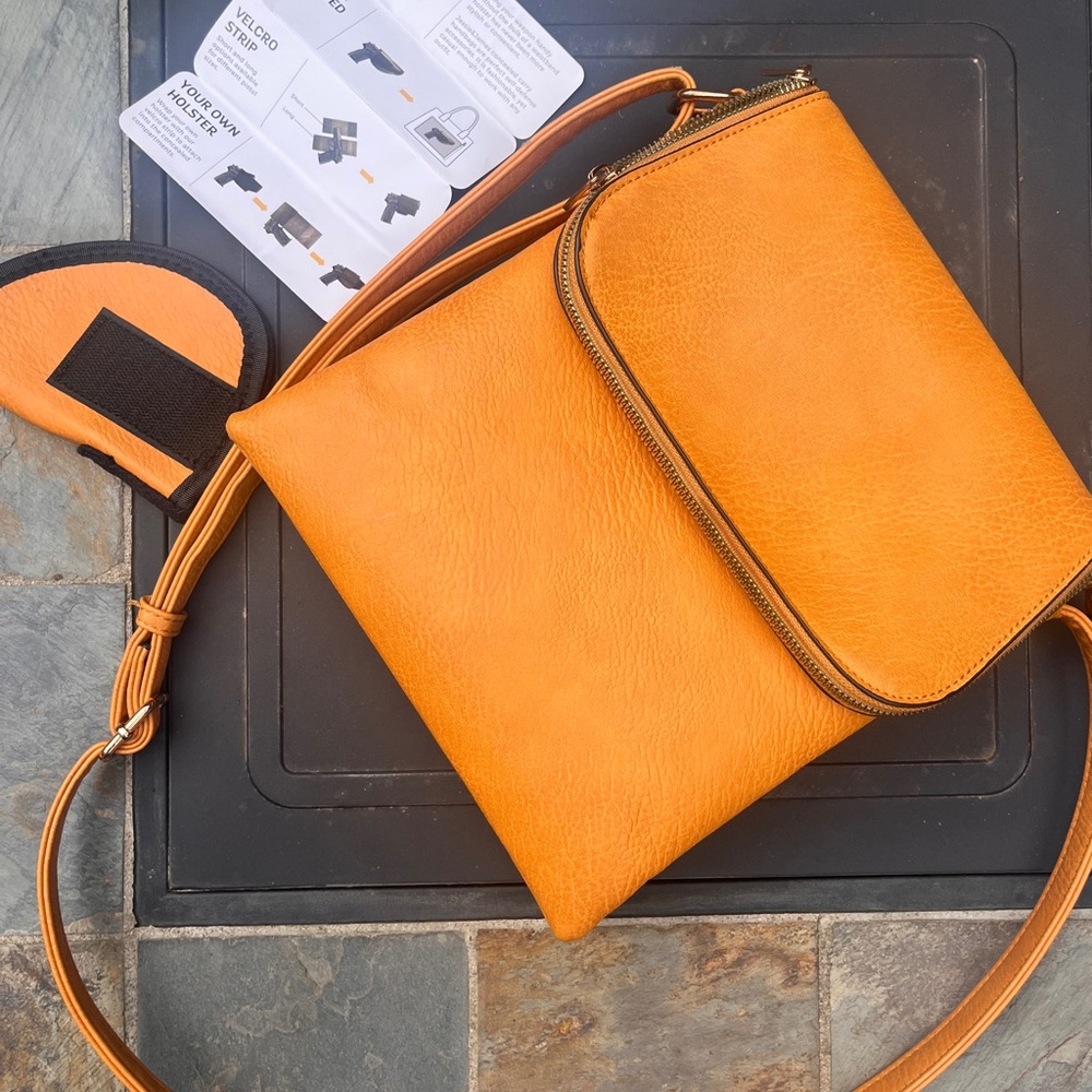 Concealed Carry Handbag Jesse James Brand in mustard color, gently used.